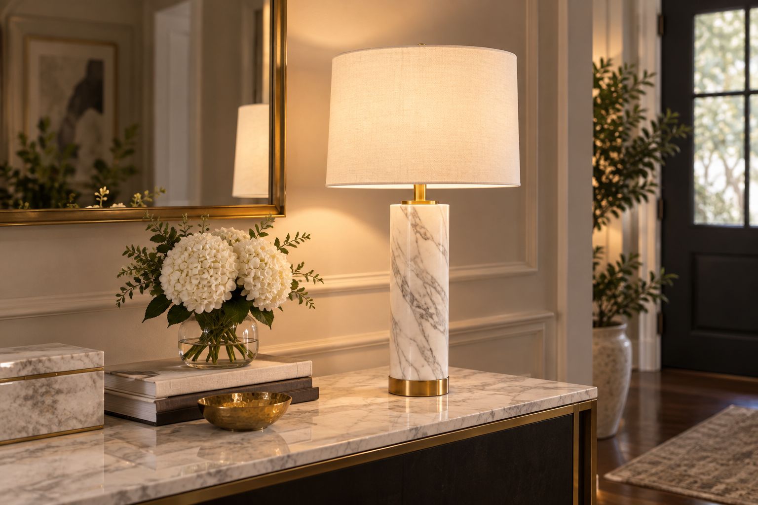 White marble table lamp styled on a console table in an entryway