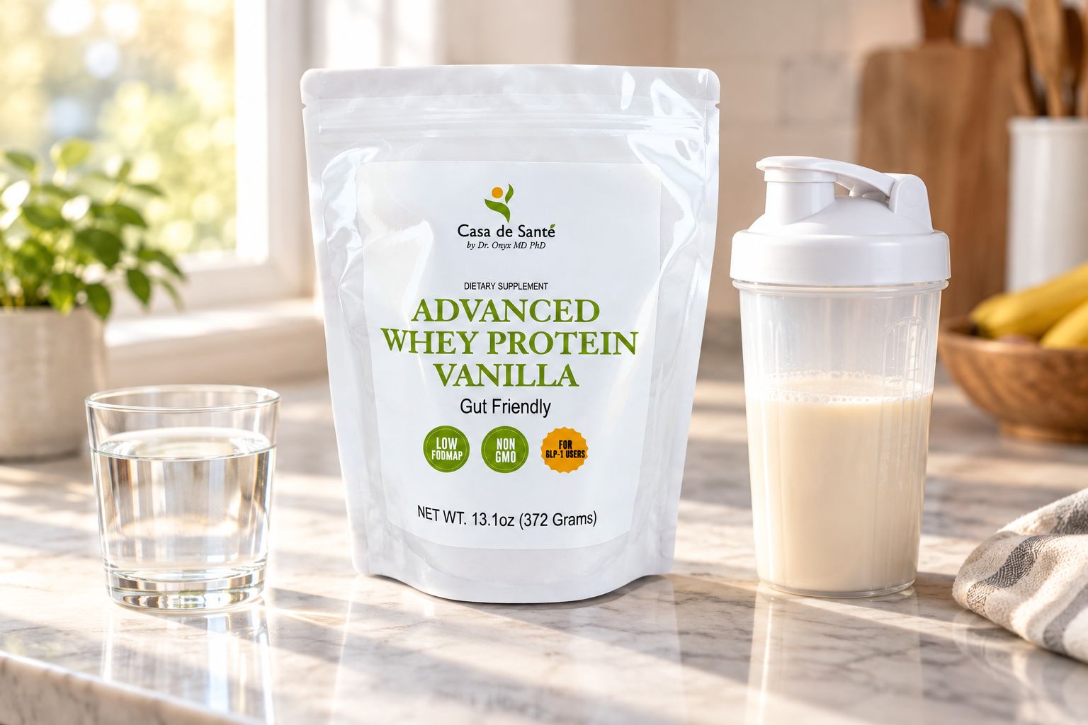 Vanilla protein powder container next to a shaker bottle on a kitchen counter