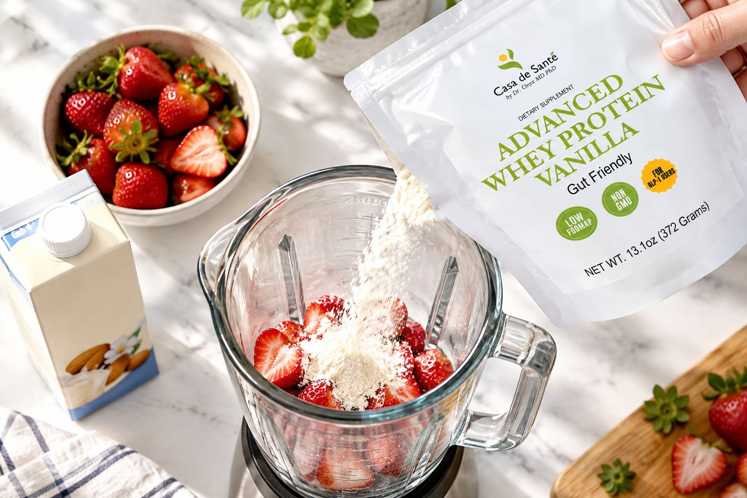 Protein powder being poured into a blender with strawberries and almond milk
