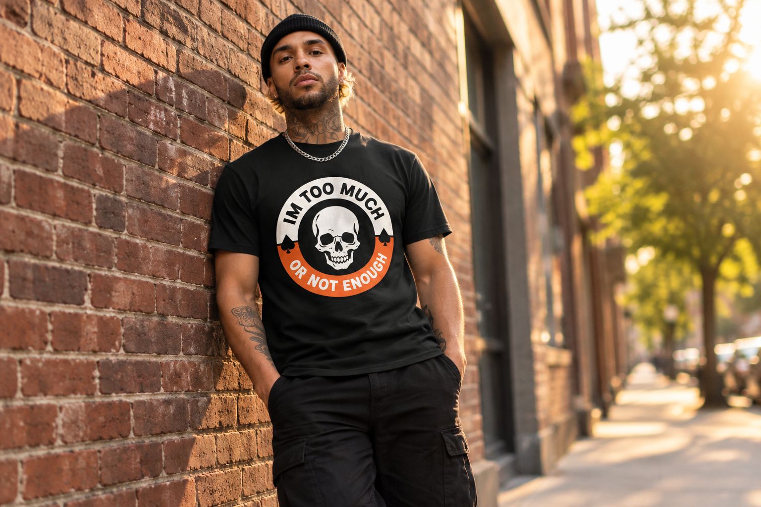 Person wearing the Too Much Not Enough ADHD tee against a brick wall