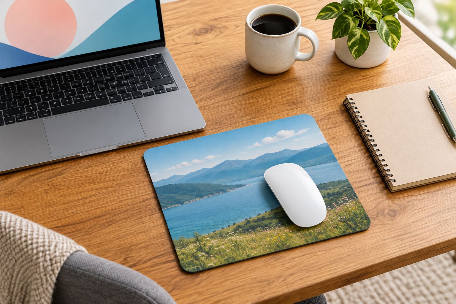 A simple landscape photo mouse mat with a mouse covering part of the picture