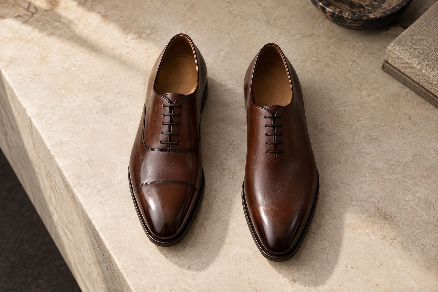 Cap-toe and wholecut Oxford shoes shown side by side