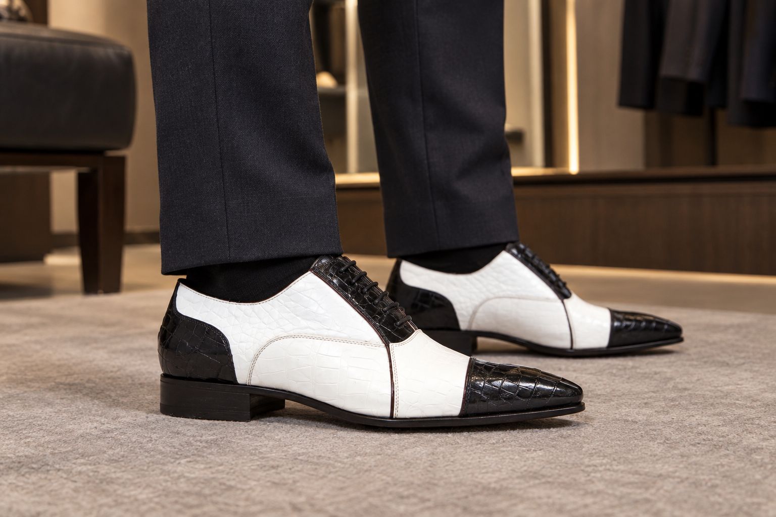 Caporicci cap-toe Oxford worn beneath tailored dark trousers