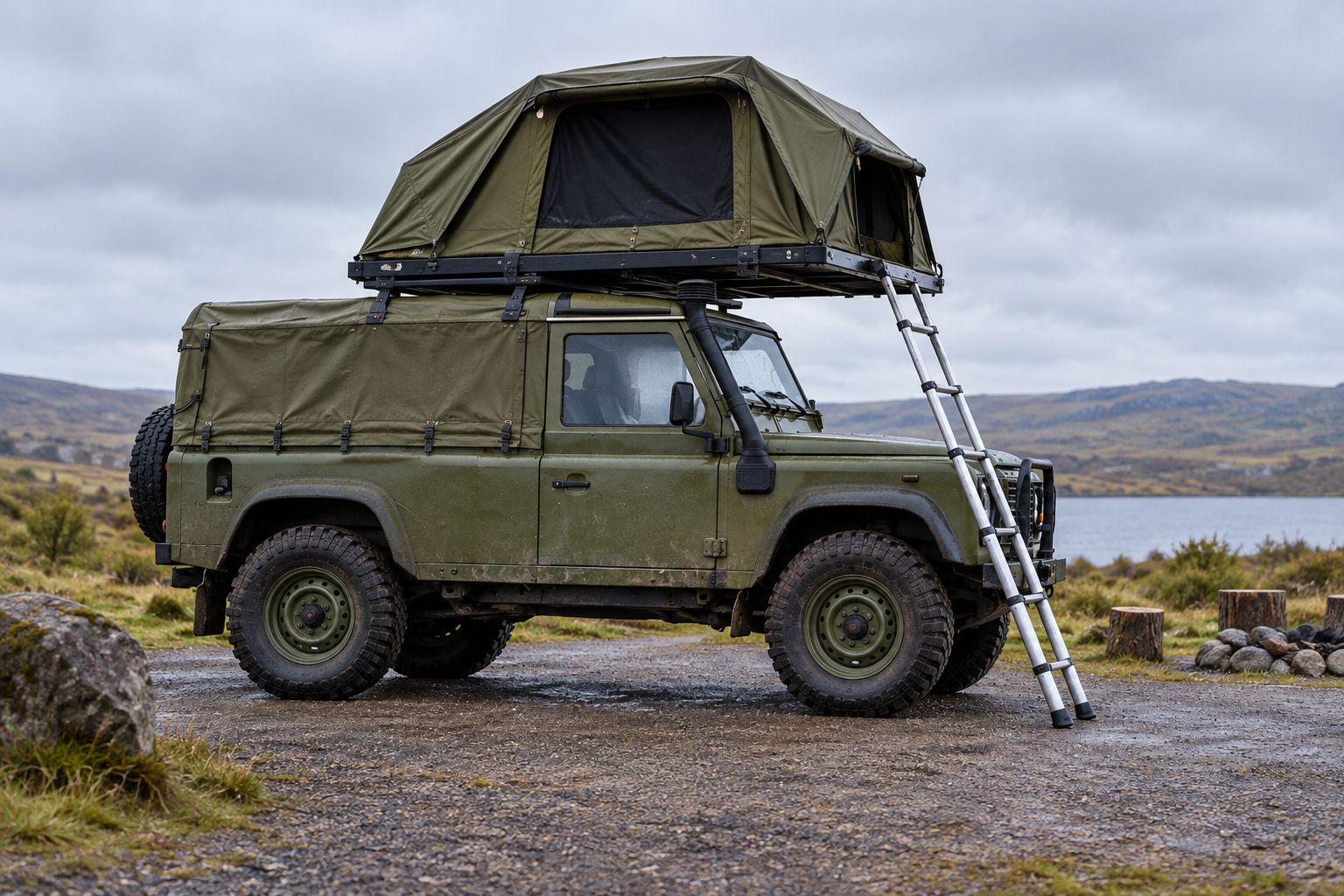 Open roof tent with clear ladder access on firm campsite ground