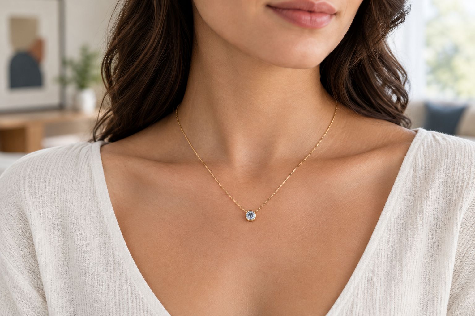 A small bezel-set gemstone necklace worn with an everyday blouse