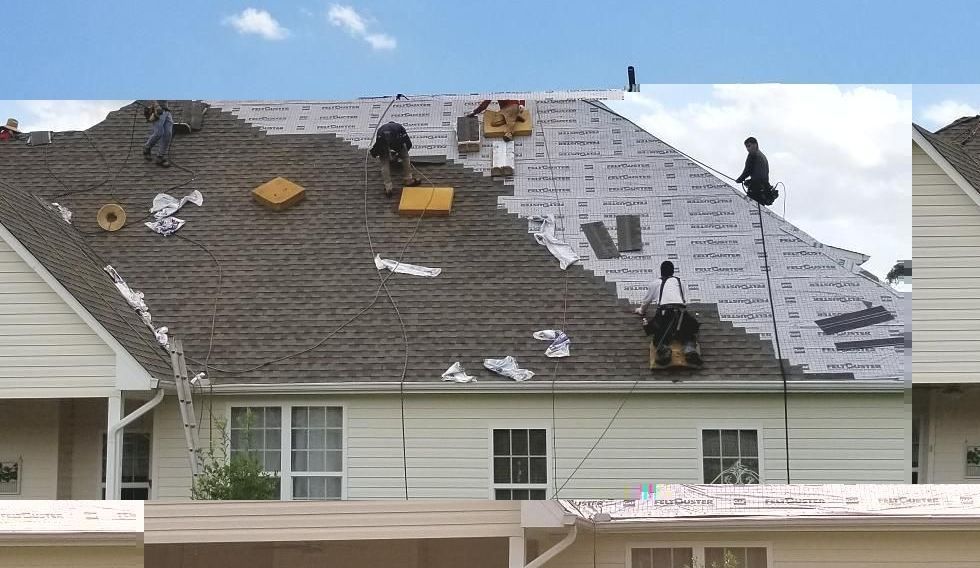 Campbell's Precision Roofing crew working on an existing shingle roof