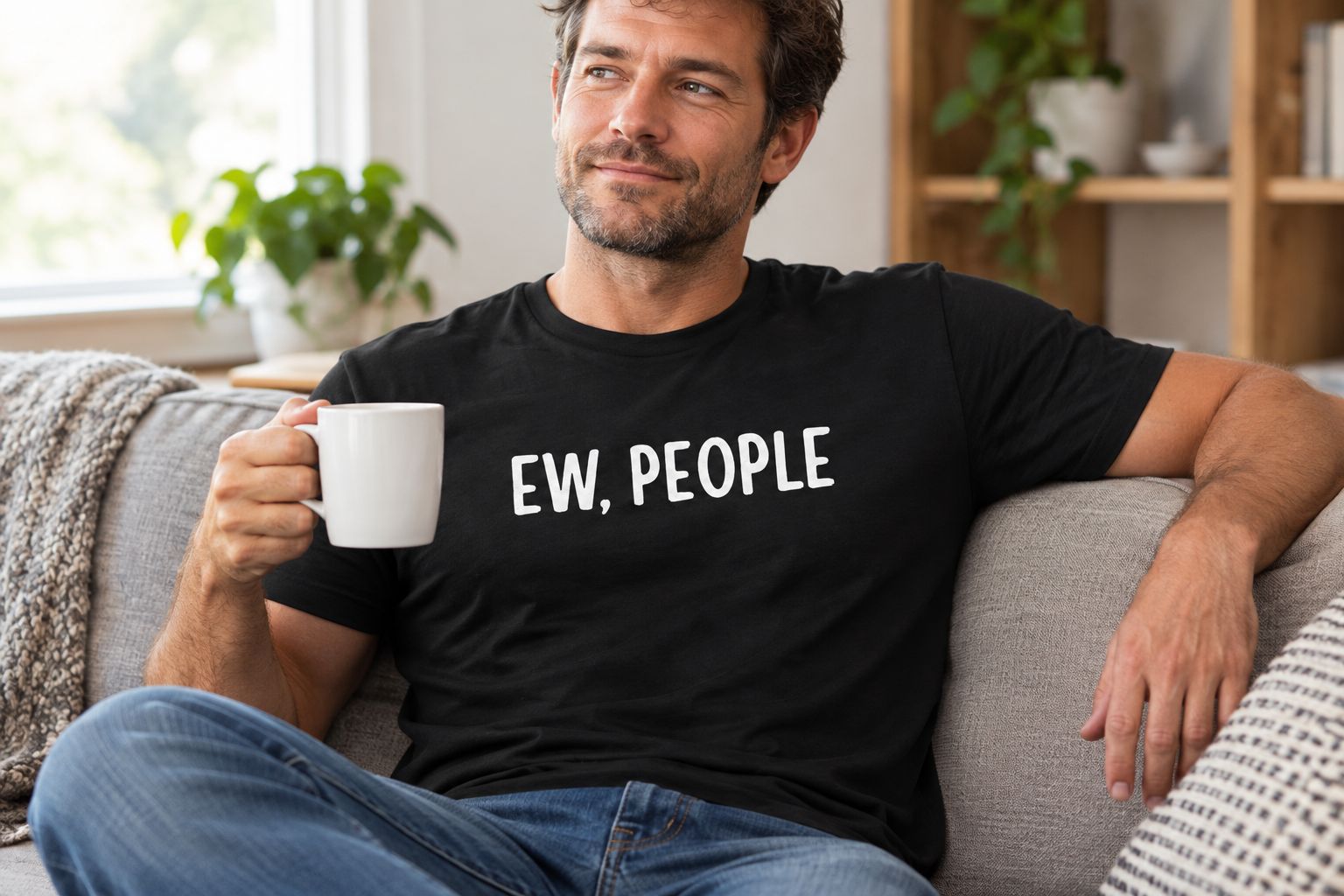An adult wearing the featured humor T-shirt while relaxing at home