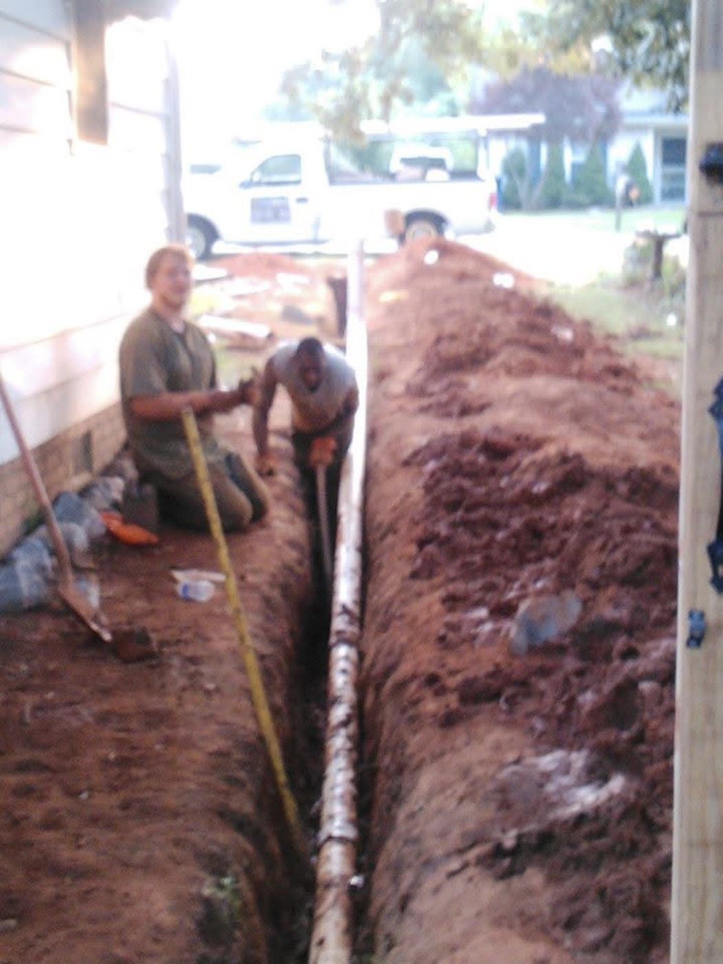 JJ's Plumbing Y2K crew working on an underground plumbing line