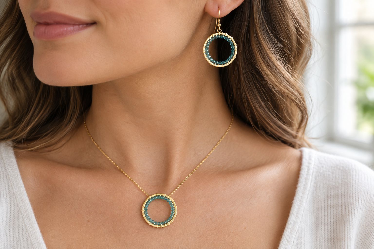 Woman wearing a minimalist gemstone jewelry set in natural light