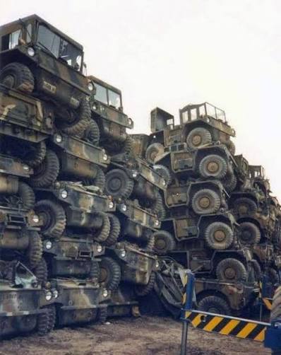 Rows of scrapped M561 Gama Goats stacked at a disposal yard in Germany