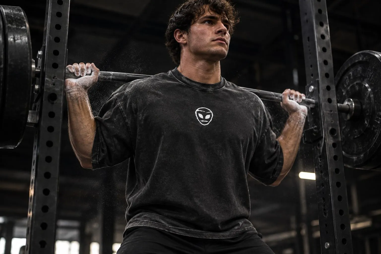 Athlete wearing the Origin Heavyweight Tee in black during a barbell lift
